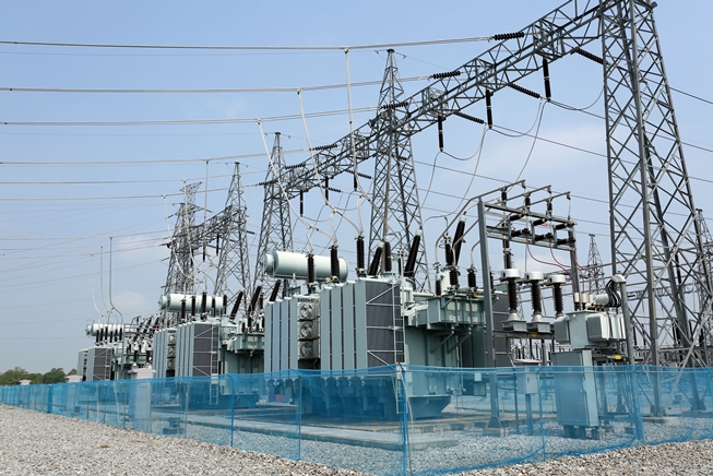 An electric transformer with distribution lines.